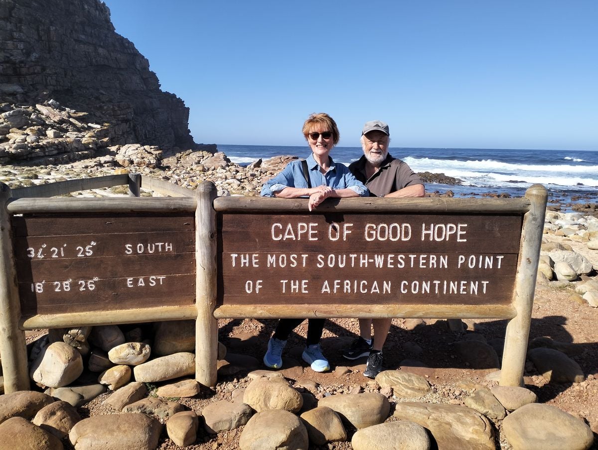 A couple at the Cape of Good Hope sign