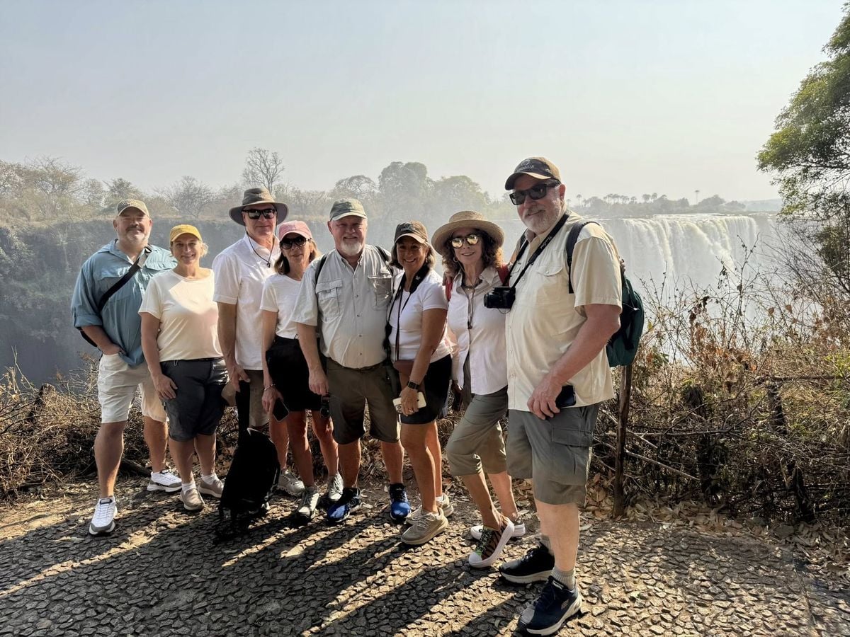 An Inspiring Vacations group at the edge of Victoria Falls