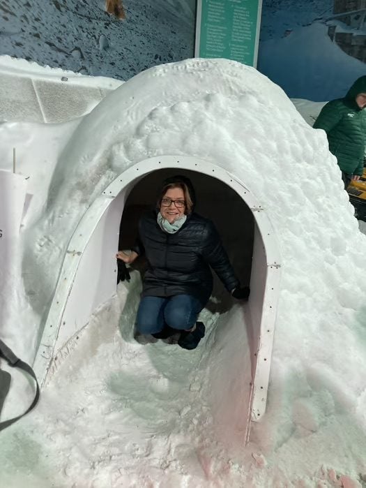 Traveller exploring a snow igloo