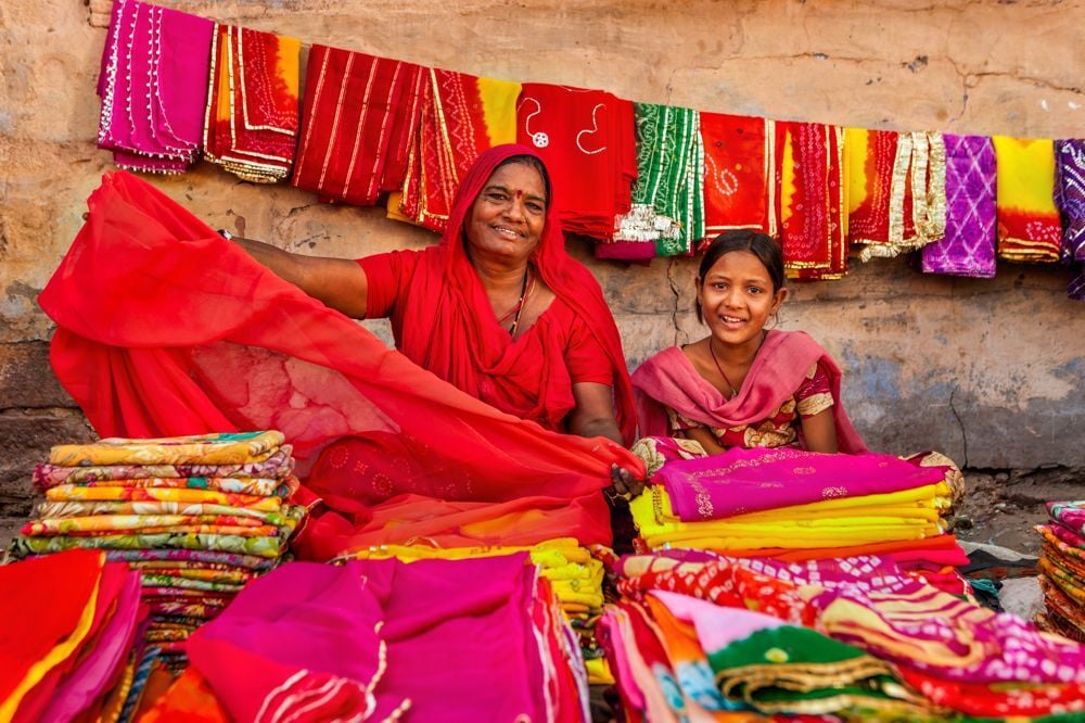 Women with vibrant textiles at an Indian market