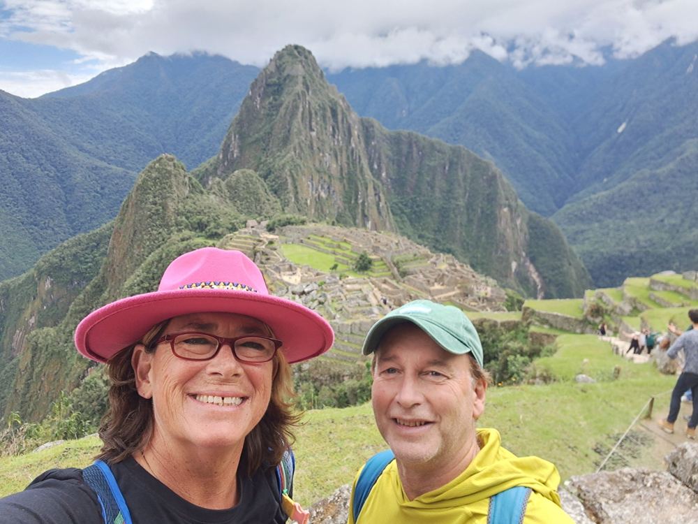 A couple taking a selfie above Machu Picchu