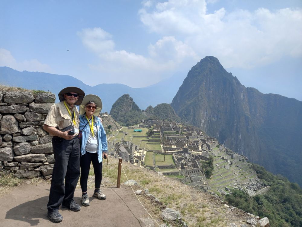 A couple on the terraces overlooking Machu Picchu
