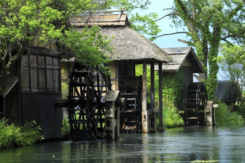 Thatched waterwheels at the Daio Wasabi Farm in the Japanese Alps