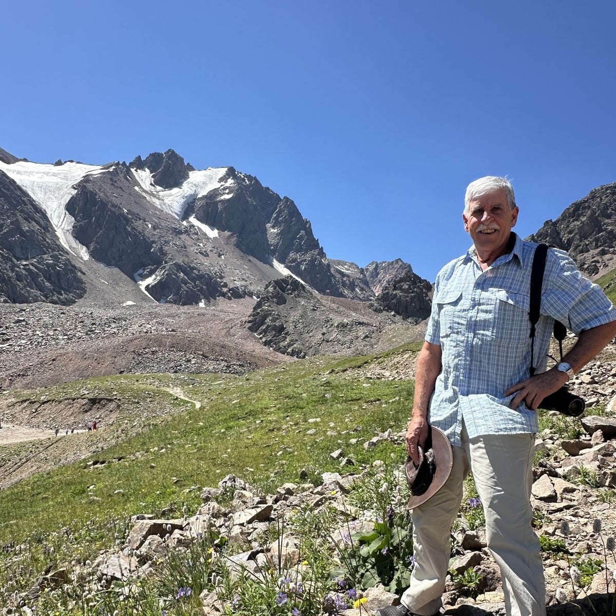 A traveller in the mountains above Almaty, Kazakhstan